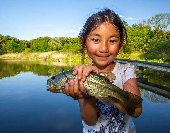 Little girl with a fish